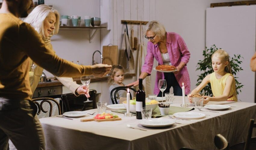 A family enjoying dinner preparation in a custom kitchen