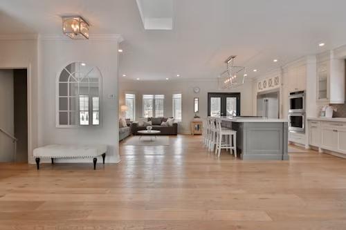 Living room and kitchen upgraded with hardwood flooring